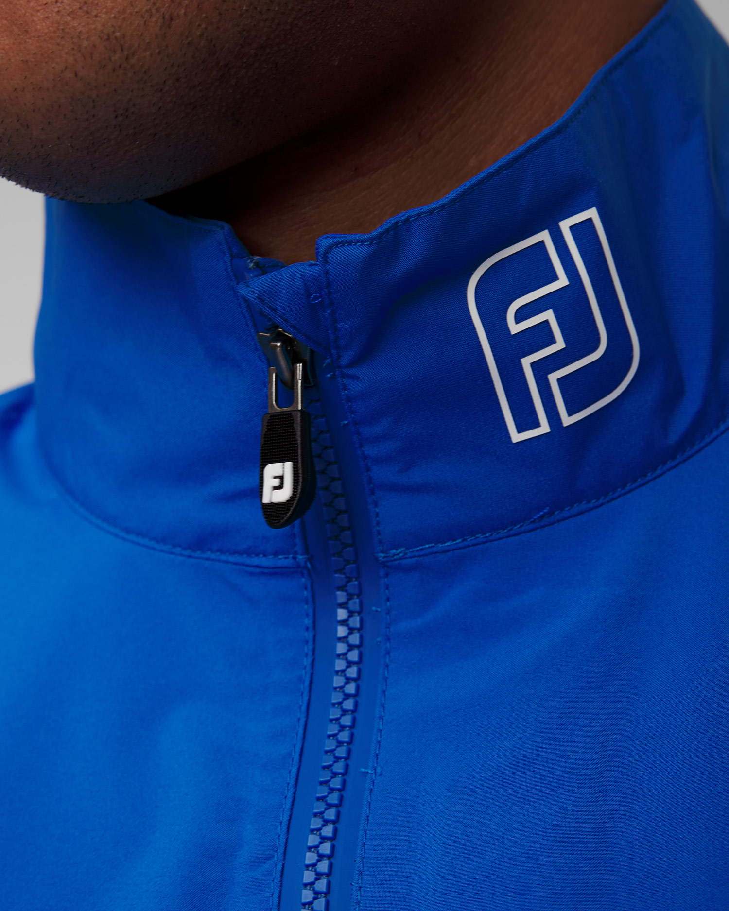 Niebieska kurtka przeciwdeszczowa męska FootJoy Eu HydroLite X