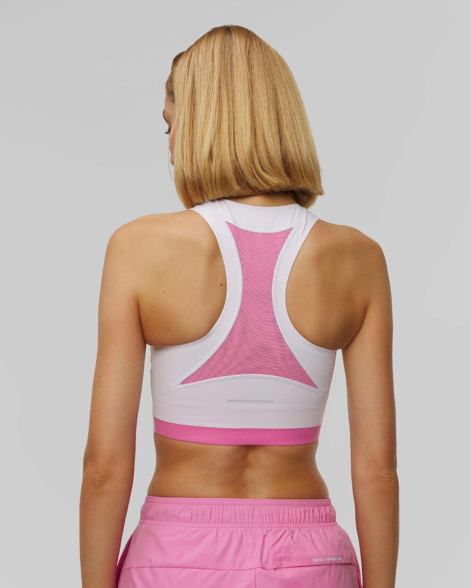Top da donna On Train 2-in-1 Crop bianco-rosa