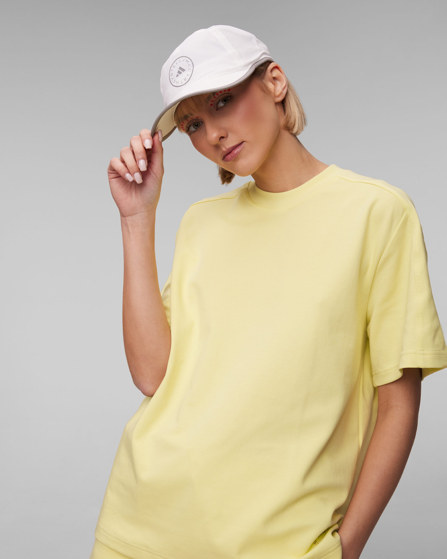 Dámske žlté tričko Adidas by Stella McCartney s logom ASMC