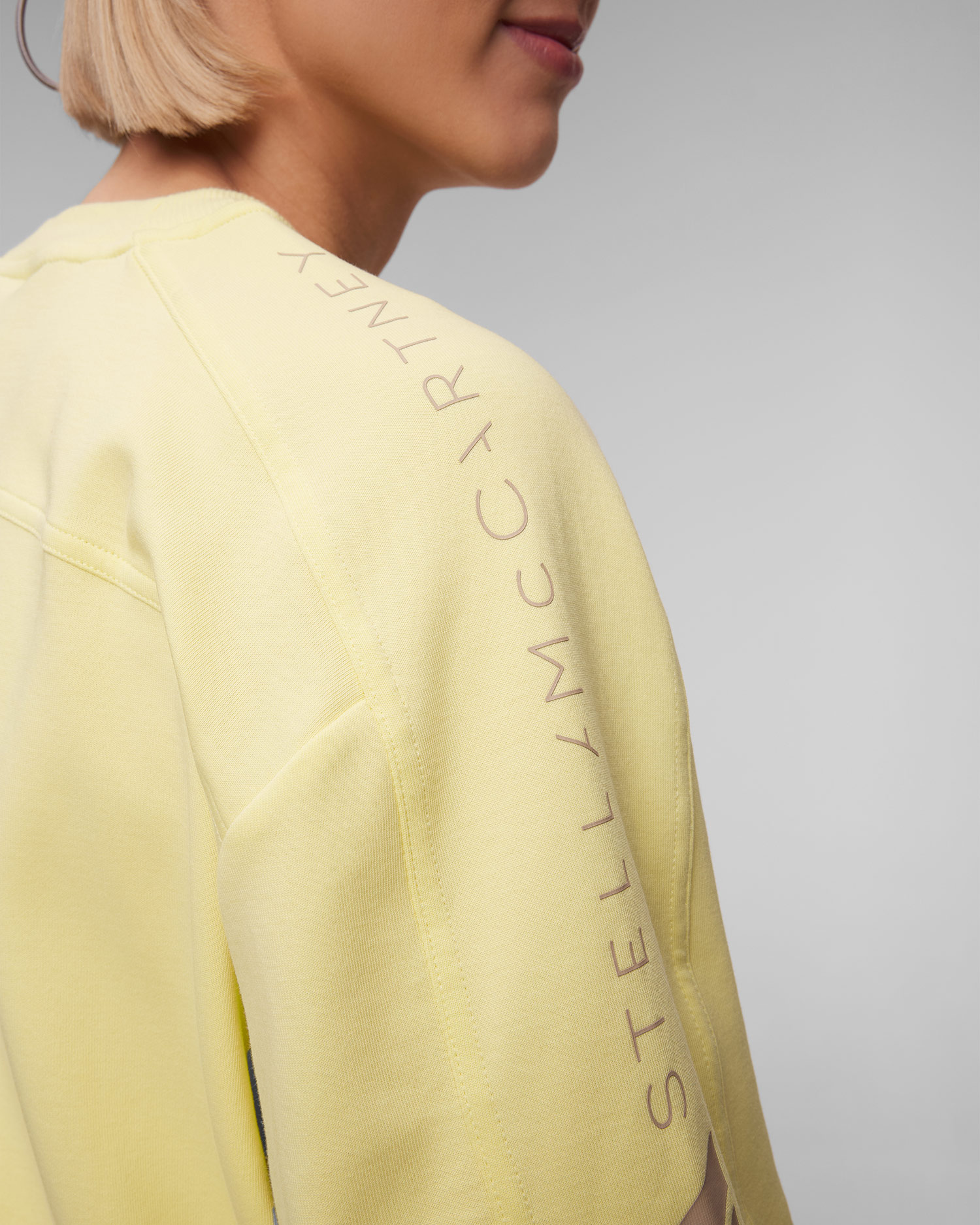 Żółty T-shirt damski Adidas by Stella McCartney ASMC Logo Tee