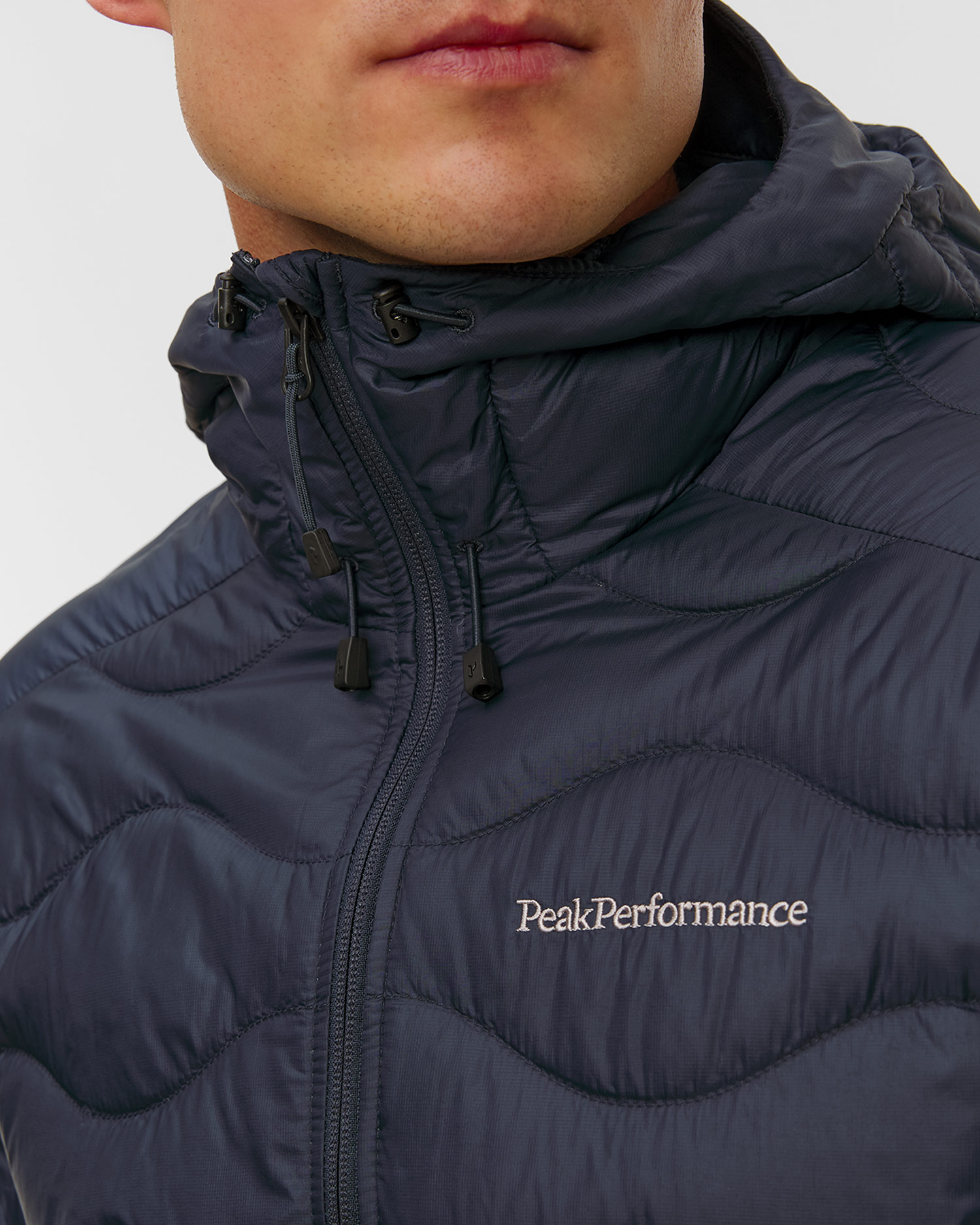 Pánska páperová bunda s kapucňou Peak Performance Helium Down Hood Jacket