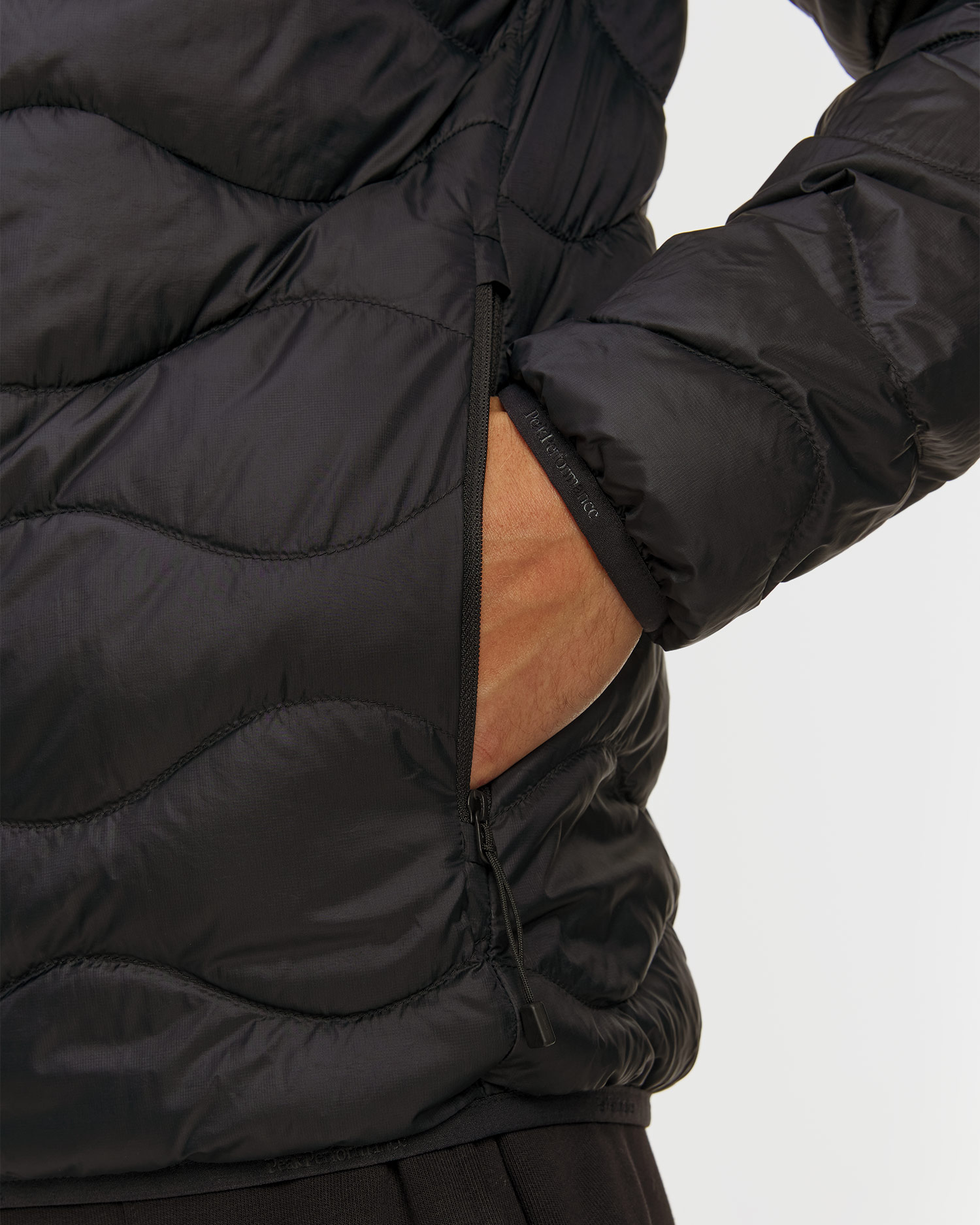 Pánska páperová bunda s kapucňou Peak Performance Helium Down Hood Jacket