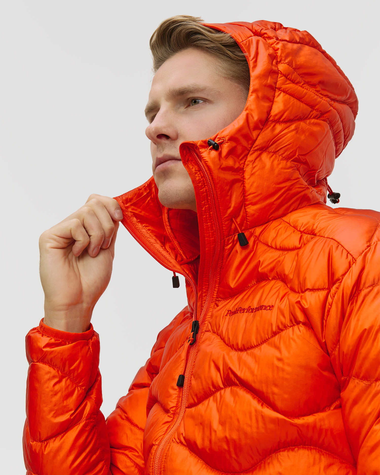 Pánska páperová bunda Peak Performance Helium Down Hood Jacket Men oranžová
