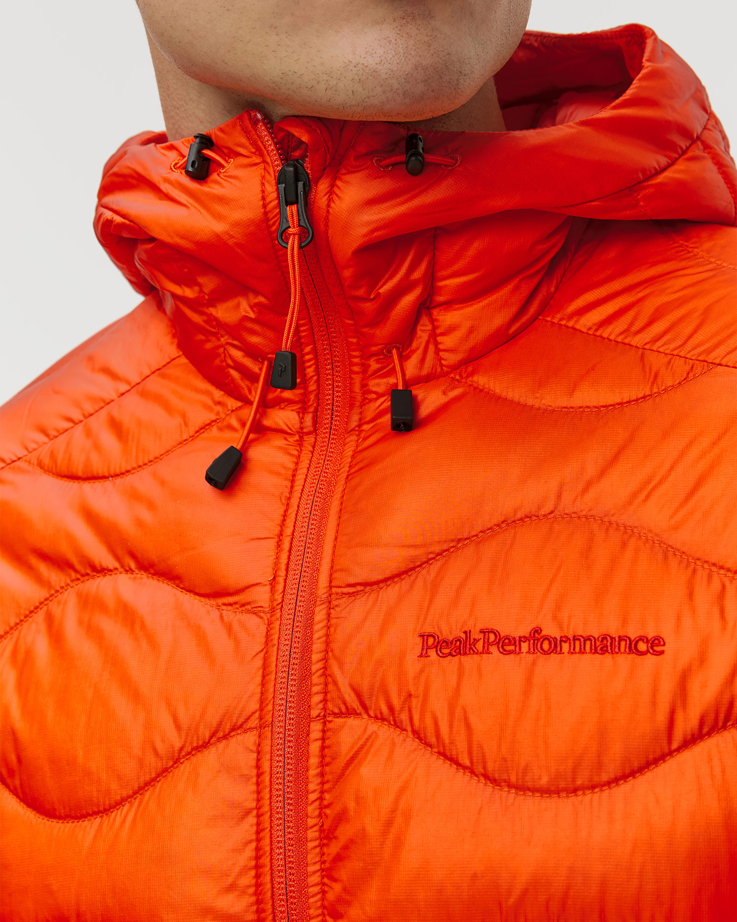 Pánska páperová bunda Peak Performance Helium Down Hood Jacket Men oranžová