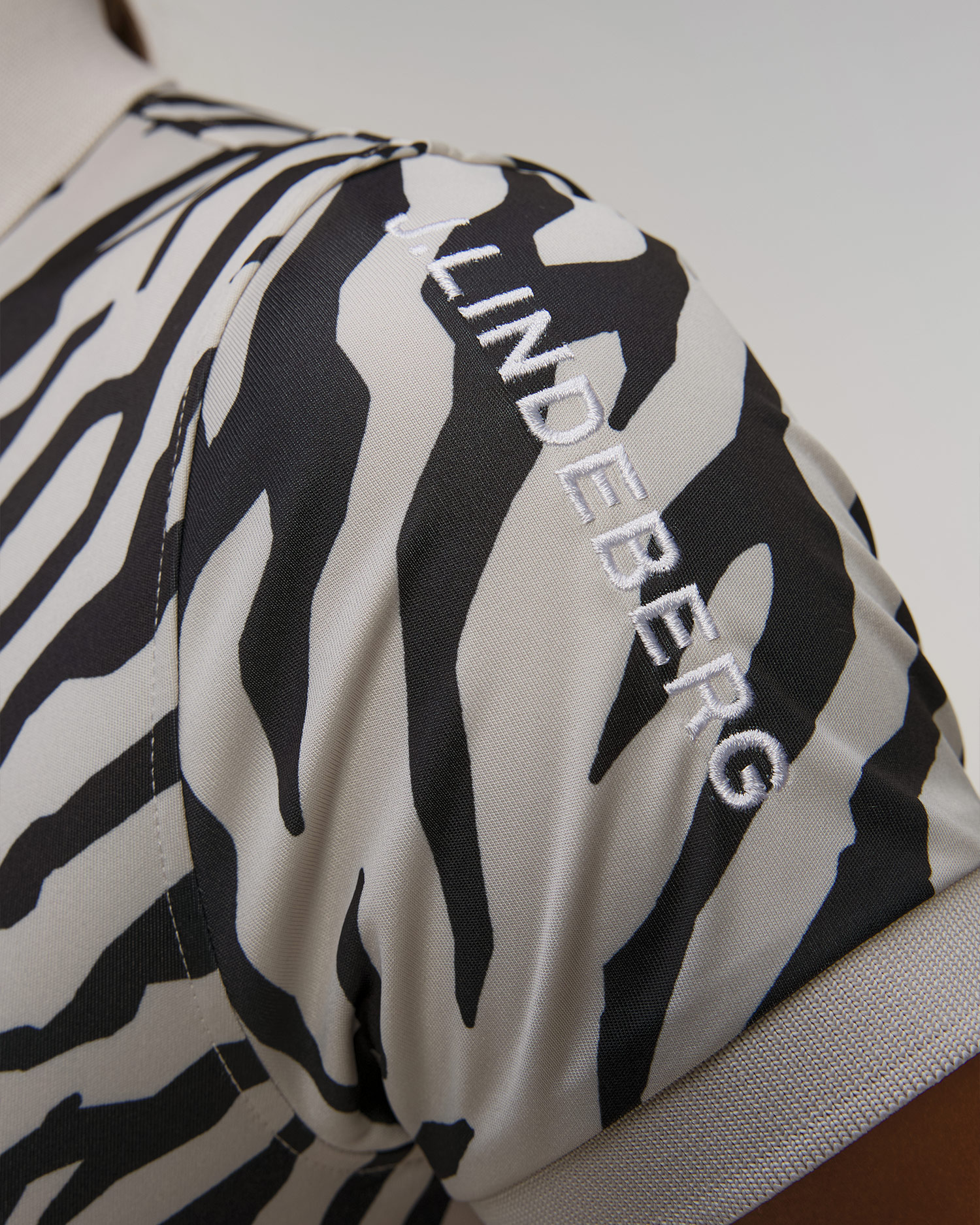 Polo technique noir et blanc pour femmes J.Lindeberg Tour Tech Print Polo