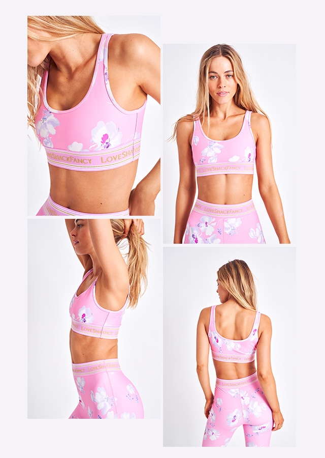 A woman in a pink top and yoga leggings