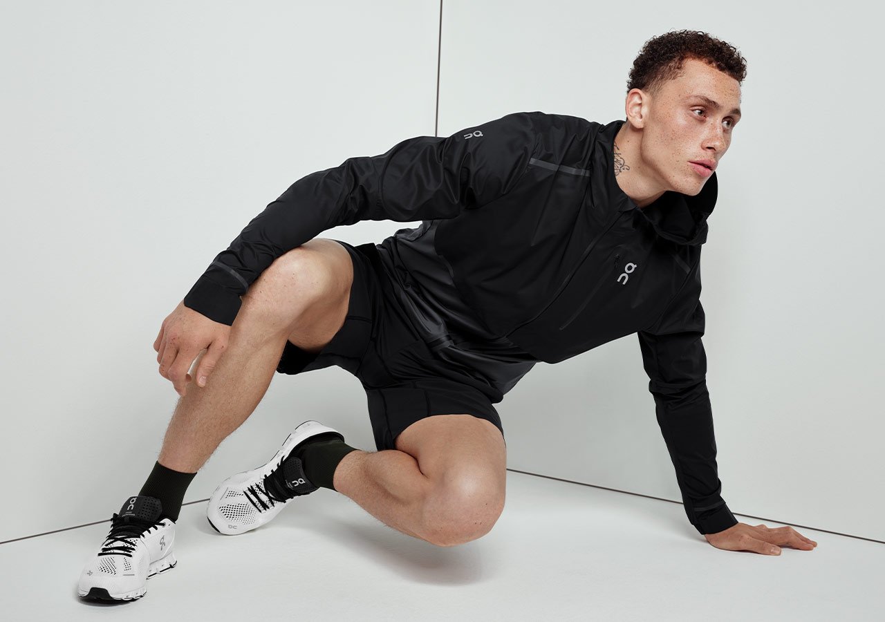 Black training suit and On Running training shoes